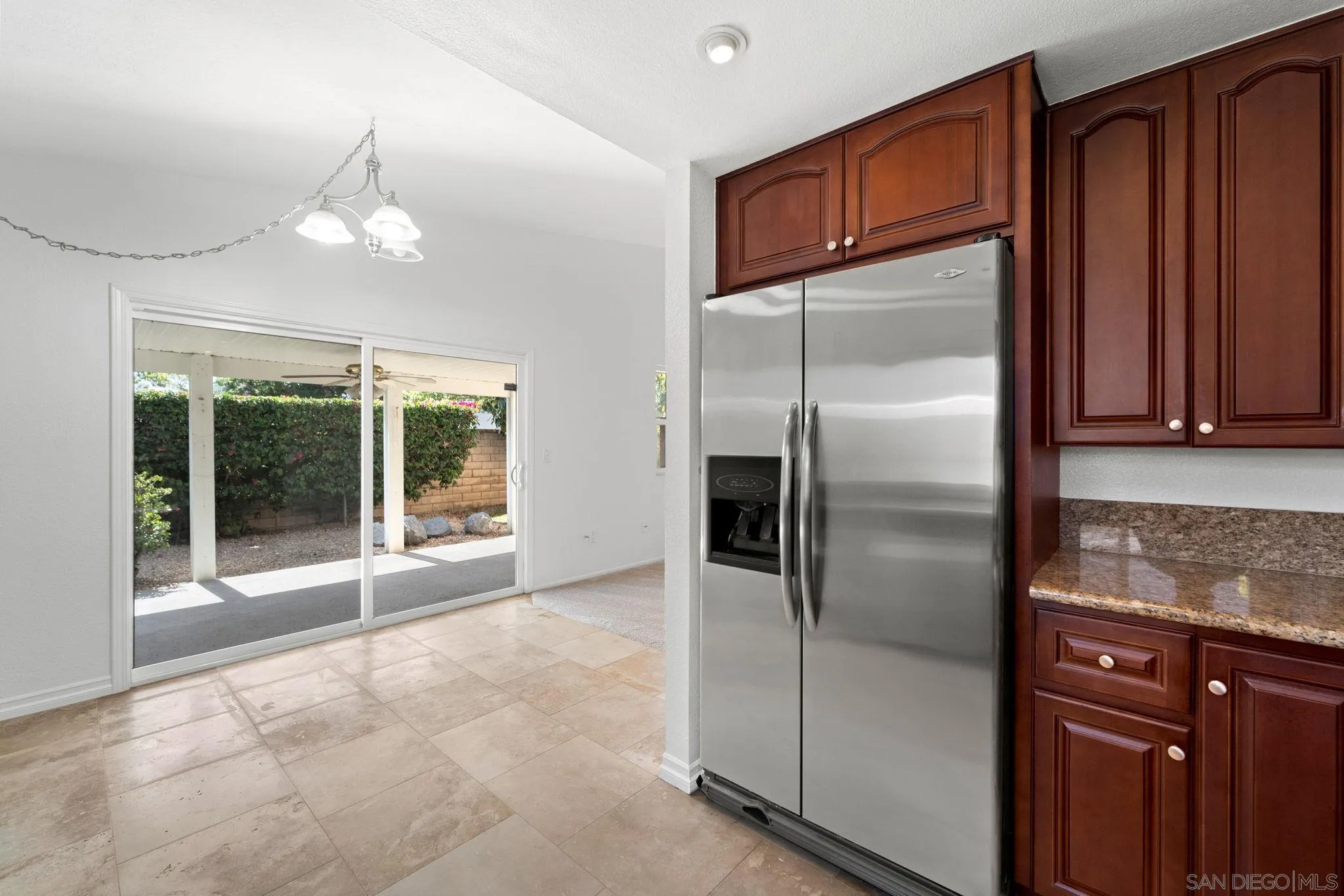 10174 West Glendon Circle Santee, CA 92071 - Photo 35 of 41 a kitchen with granite countertop a refrigerator and a sink