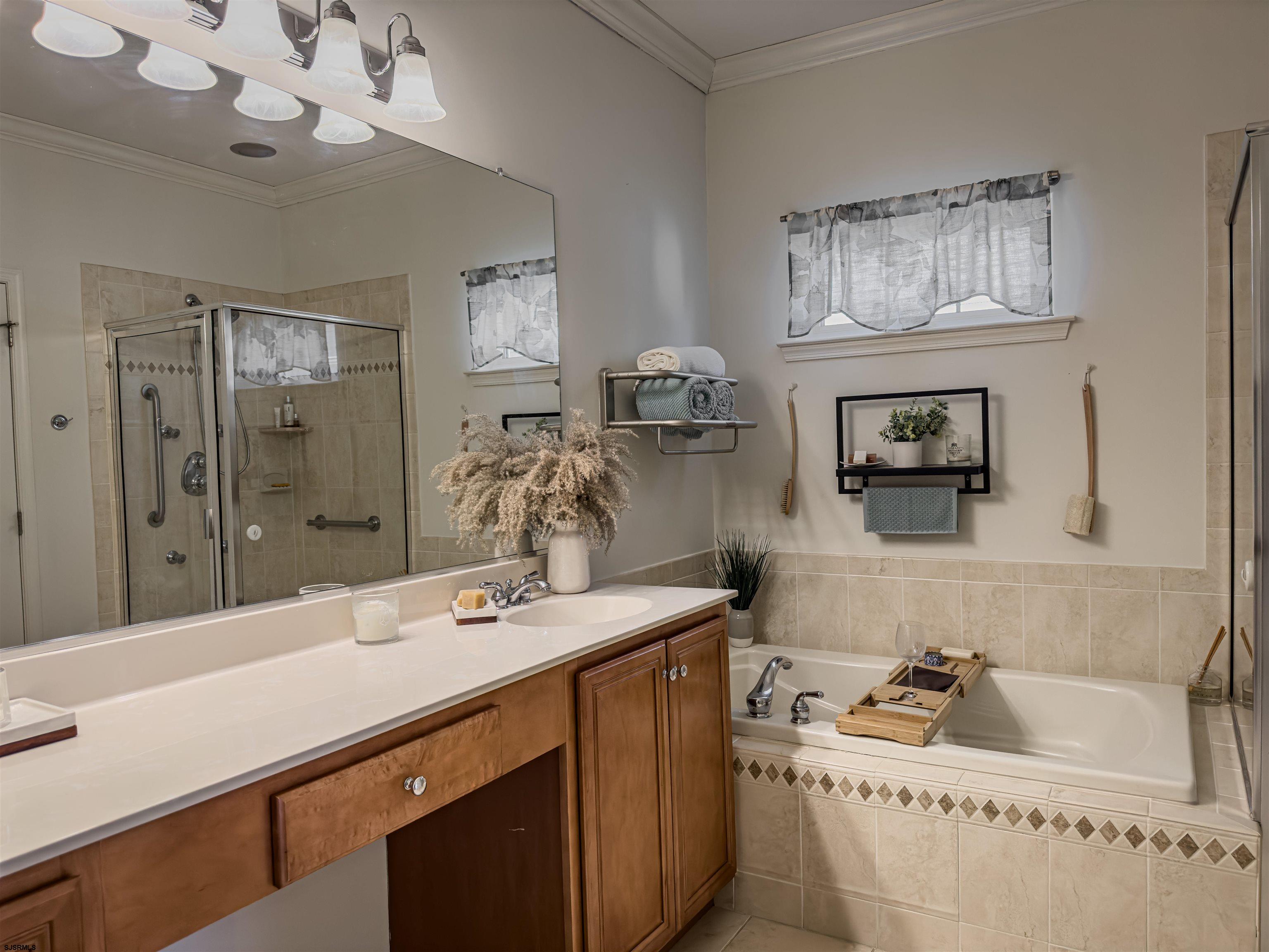 307 Gosling Way Glassboro, NJ 08028 - Photo 5 of 7 a bathroom with a sink a large mirror and a bathtub