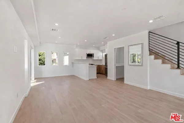 a view of a kitchen with a sink cabinets and window