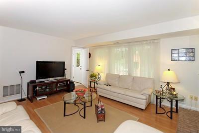 13020 Tamarack Road Silver Spring, MD 20904 - Photo 3 of 25 a living room with furniture and a flat screen tv
