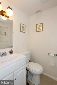 13020 Tamarack Road Silver Spring, MD 20904 - Photo 22 of 25 a bathroom with a sink a toilet and mirror