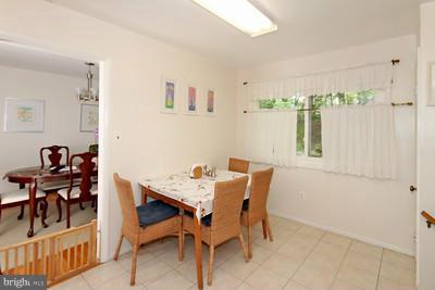 13020 Tamarack Road Silver Spring, MD 20904 - Photo 5 of 25 a view of a dining room with furniture and chandelier
