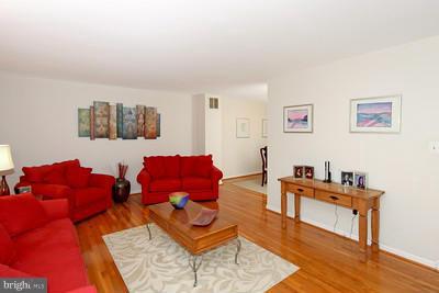 13020 Tamarack Road Silver Spring, MD 20904 - Photo 7 of 25 a living room with furniture and a wooden floor