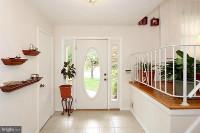 13020 Tamarack Road Silver Spring, MD 20904 - Photo 9 of 25 a view of a hallway with wooden floor and staircase