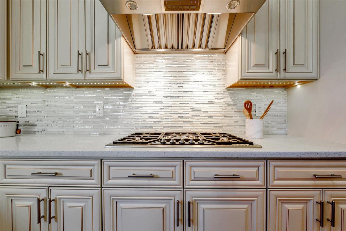 10380 Sterling Boulevard Cupertino, CA 95014 - Photo 13 of 49 a kitchen with granite countertop white cabinets and white appliances