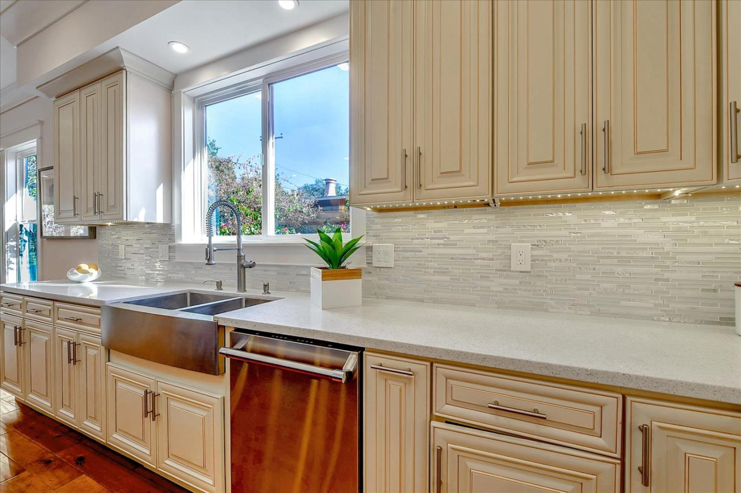 10380 Sterling Boulevard Cupertino, CA 95014 - Photo 15 of 49 a kitchen with stainless steel appliances granite countertop a sink a window and white cabinets