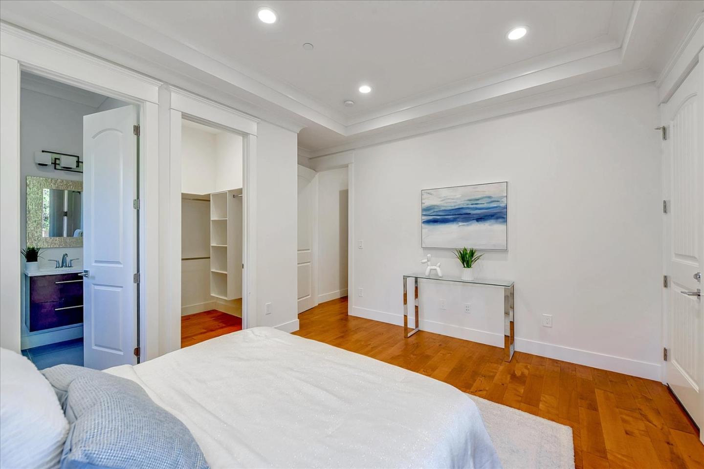 10380 Sterling Boulevard Cupertino, CA 95014 - Photo 27 of 49 a bedroom with a bed and a table in it