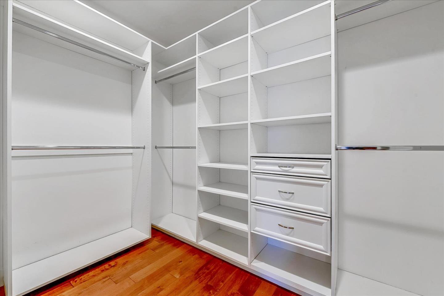 10380 Sterling Boulevard Cupertino, CA 95014 - Photo 31 of 49 a view of walk in closet with empty racks