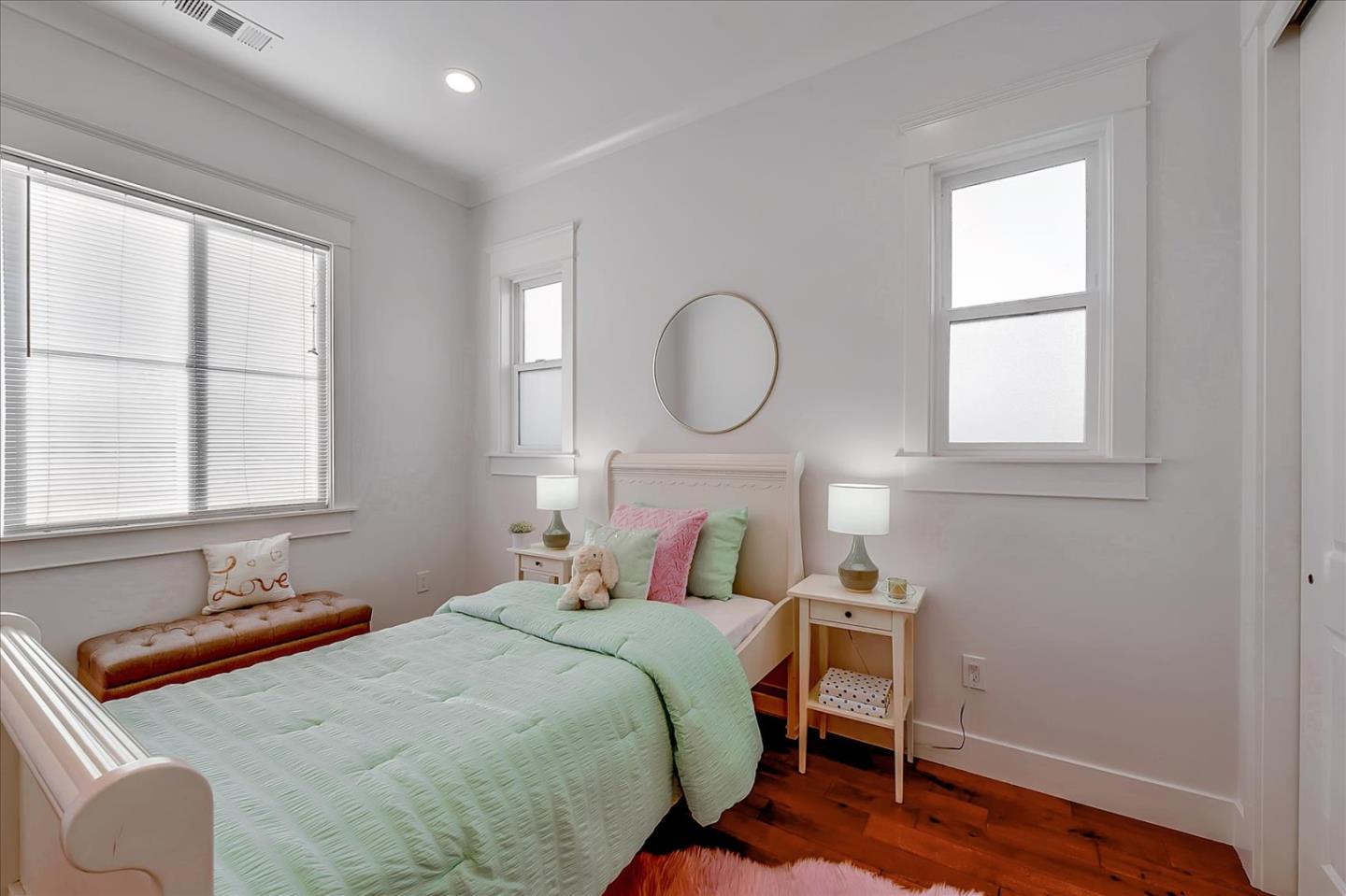 10380 Sterling Boulevard Cupertino, CA 95014 - Photo 34 of 49 a bedroom with a bed and window