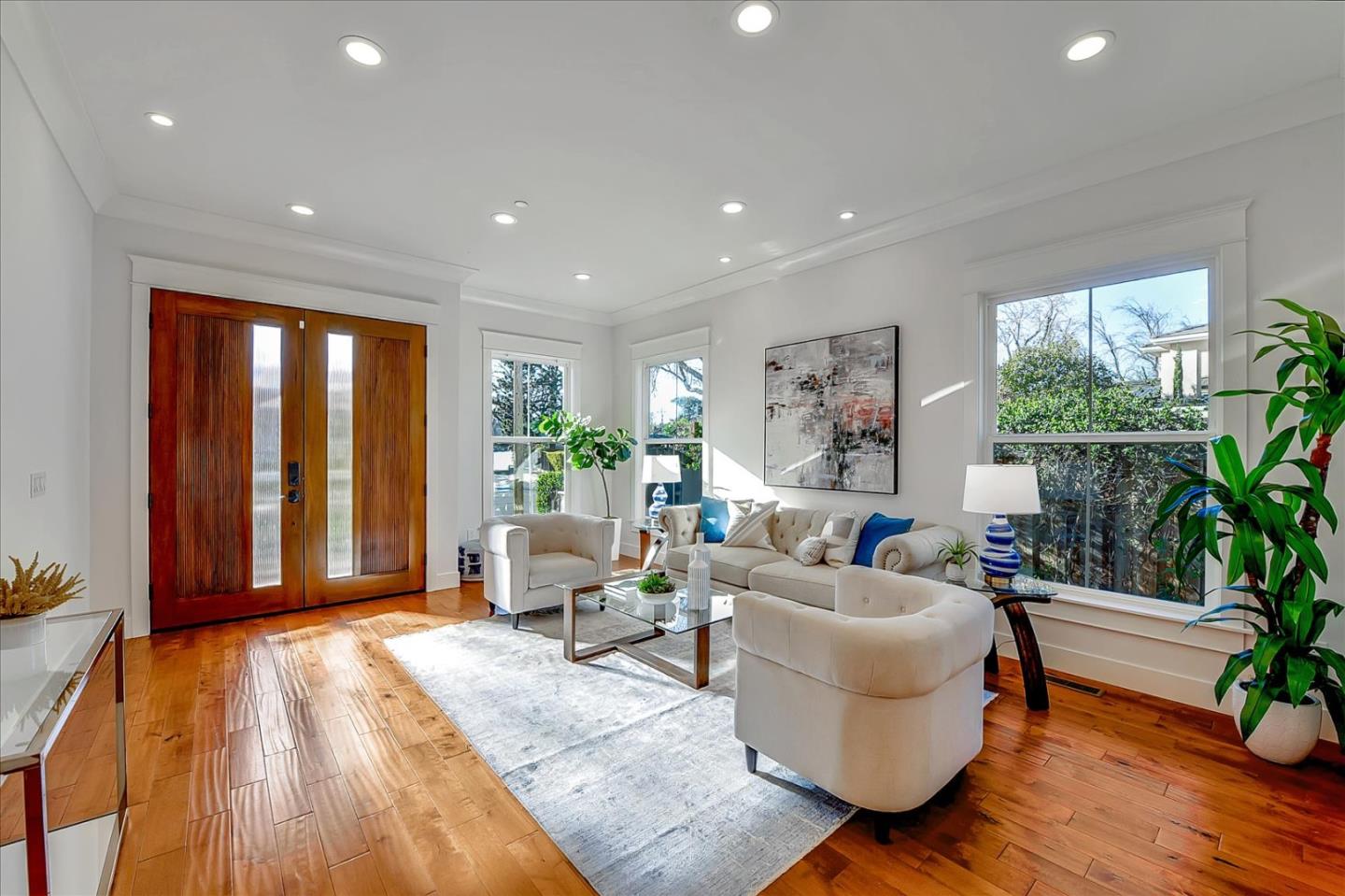10380 Sterling Boulevard Cupertino, CA 95014 - Photo 4 of 49 a living room with furniture and a large window