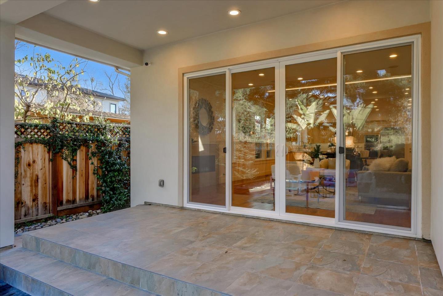 10380 Sterling Boulevard Cupertino, CA 95014 - Photo 44 of 49 a view of a hallway with wooden floor and windows