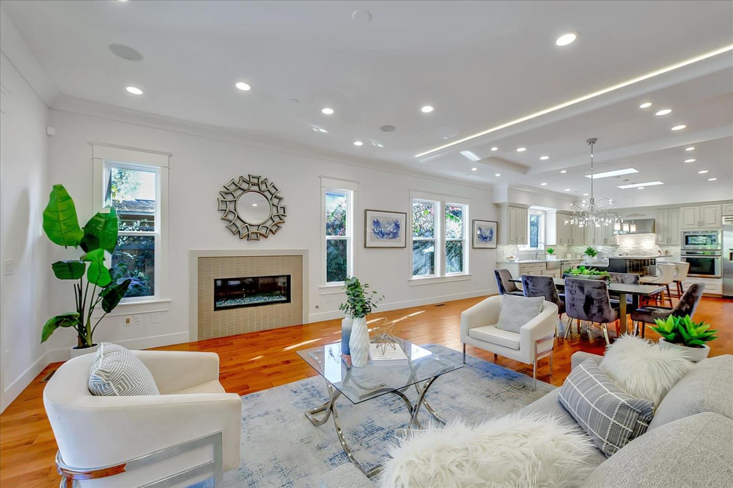 10380 Sterling Boulevard Cupertino, CA 95014 - Photo 8 of 49 a living room with furniture fireplace and potted plant
