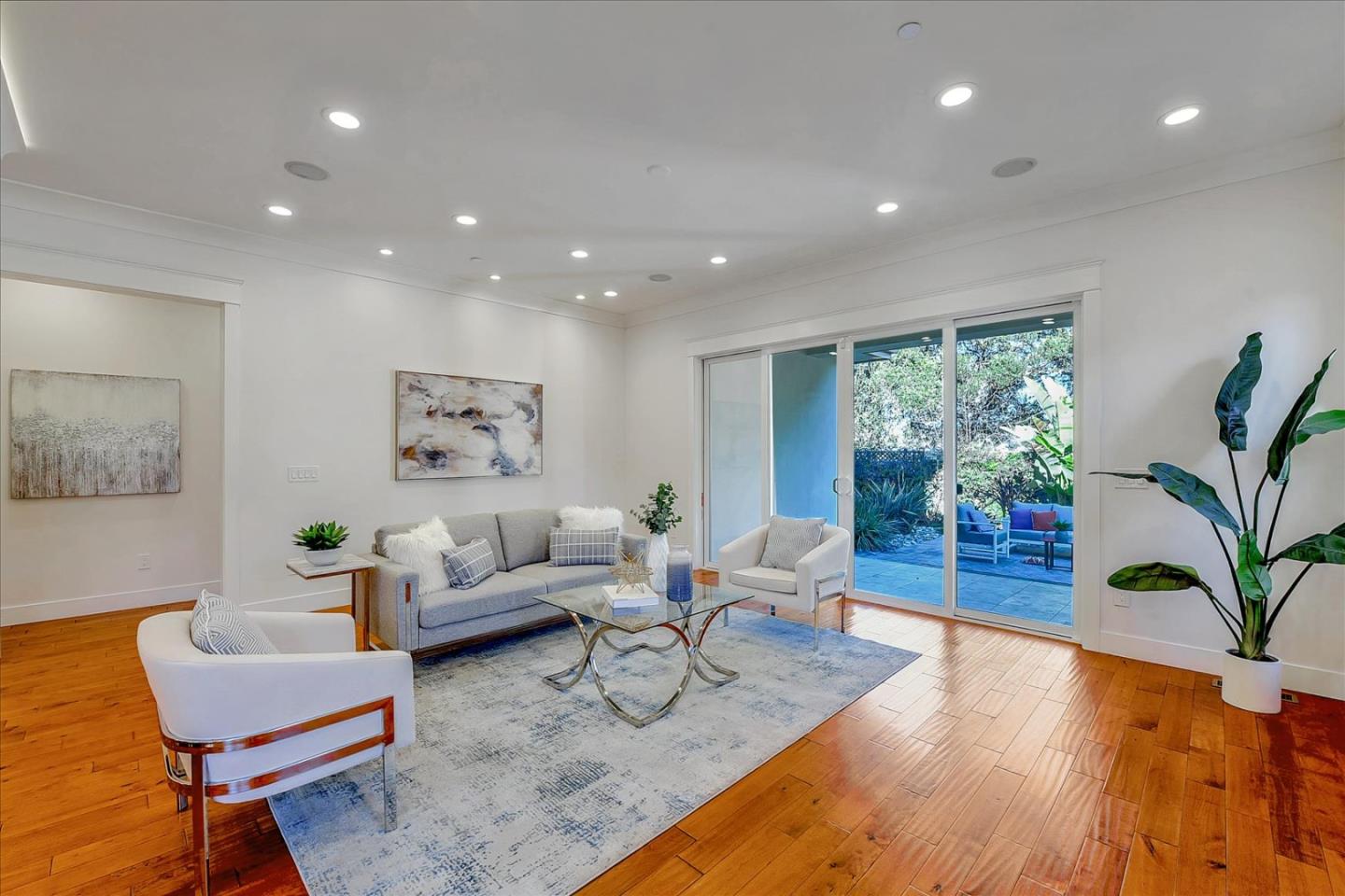 10380 Sterling Boulevard Cupertino, CA 95014 - Photo 10 of 49 a living room with furniture and a potted plant