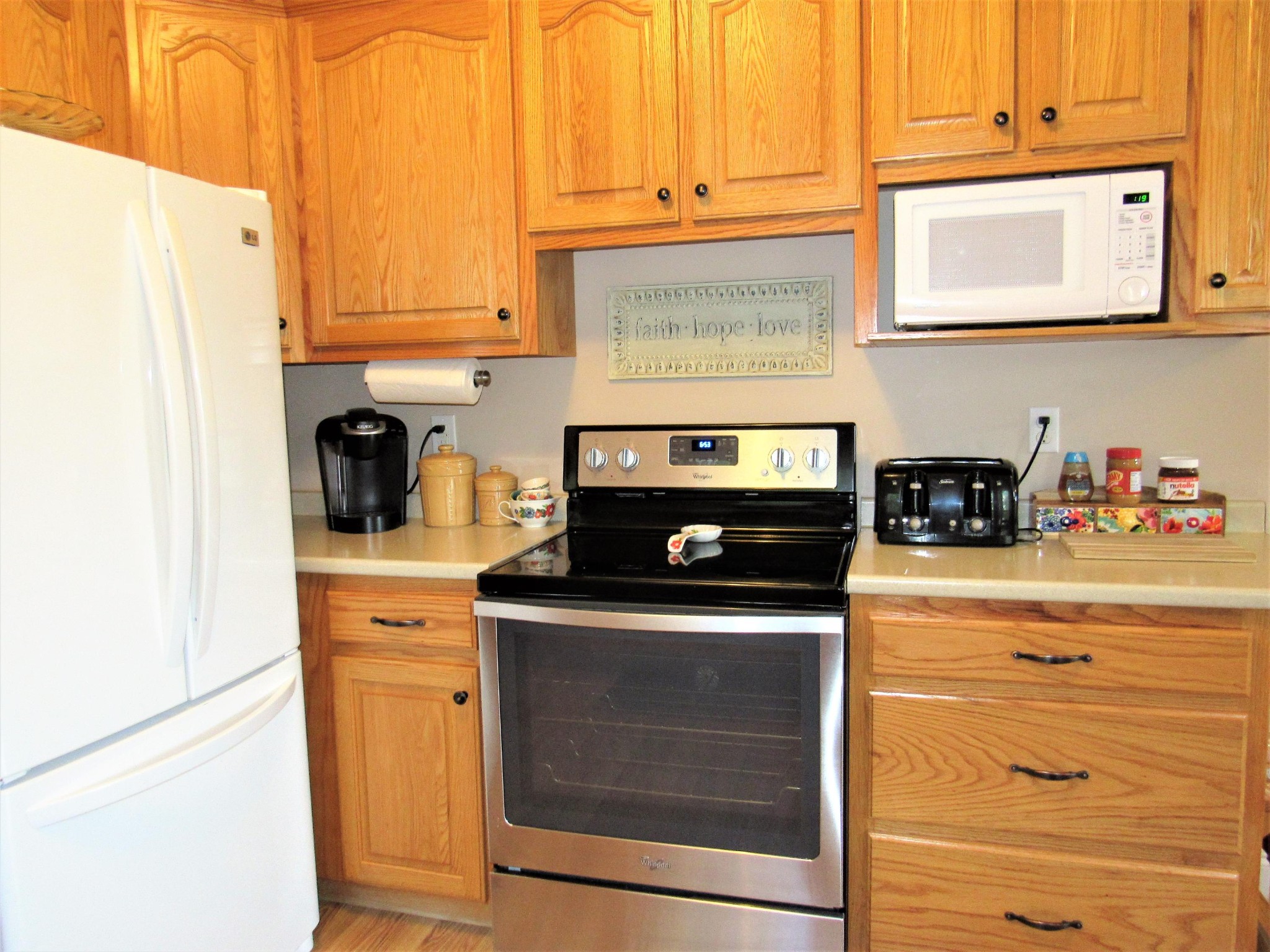 155 Fritts Road Lancing, TN 37770 - Photo 12 of 30 a kitchen with stainless steel appliances granite countertop white cabinets and a stove