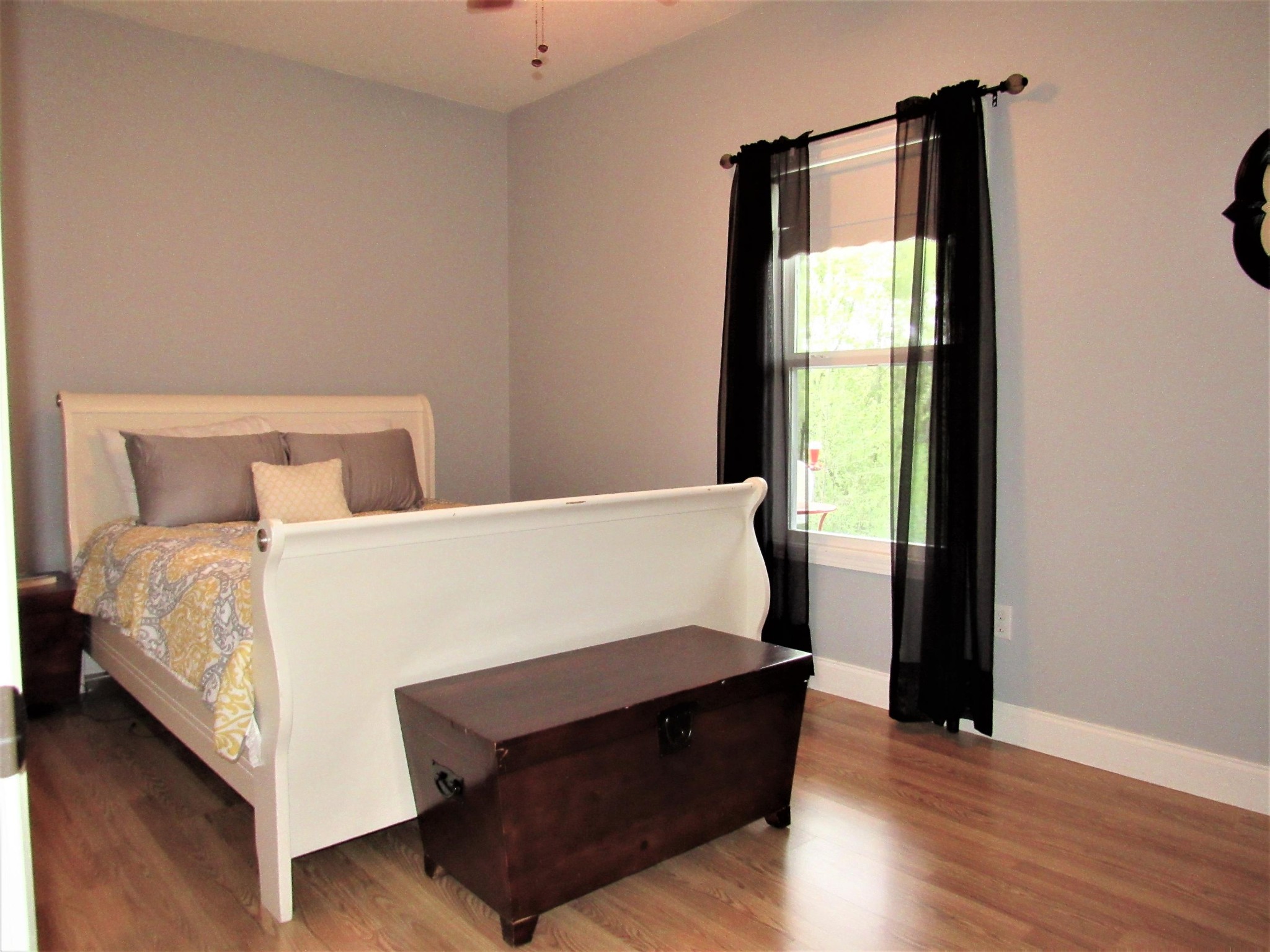 155 Fritts Road Lancing, TN 37770 - Photo 16 of 30 a bed sitting in a bedroom next to a window