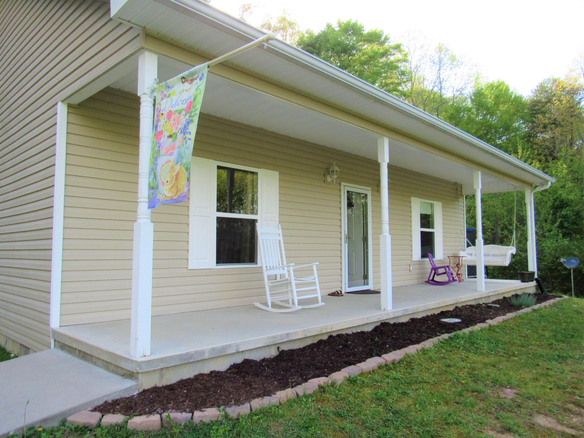 155 Fritts Road Lancing, TN 37770 - Photo 2 of 30 a front view of a house with yard and outdoor seating