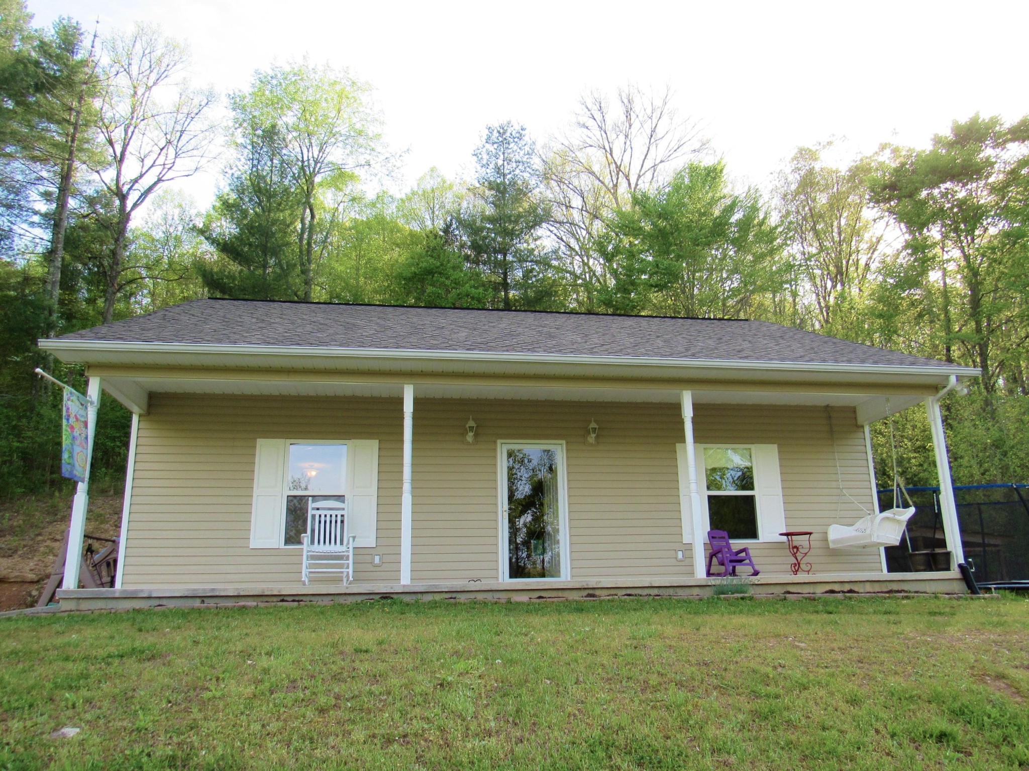 155 Fritts Road Lancing, TN 37770 - Photo 24 of 30 a house that has a tree in front of it