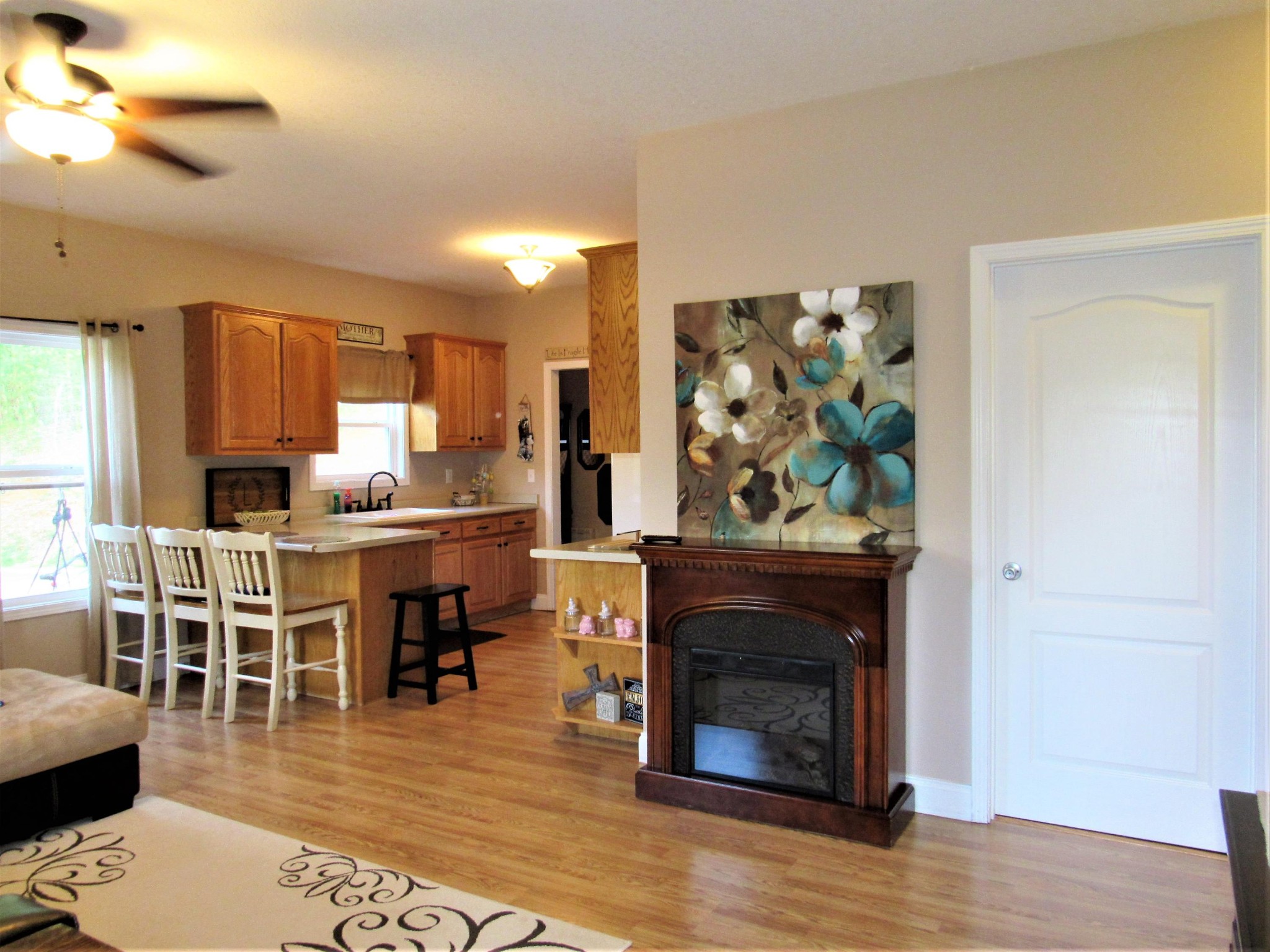 155 Fritts Road Lancing, TN 37770 - Photo 6 of 30 a living room with furniture a fireplace and wooden floor