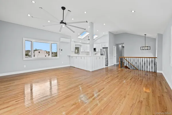 a view of a kitchen with a sink cabinets and wooden floor