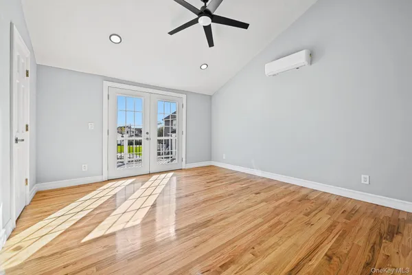 a bedroom with a bed and a walk in closet