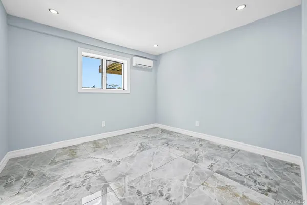 a view of livingroom with washer and dryer