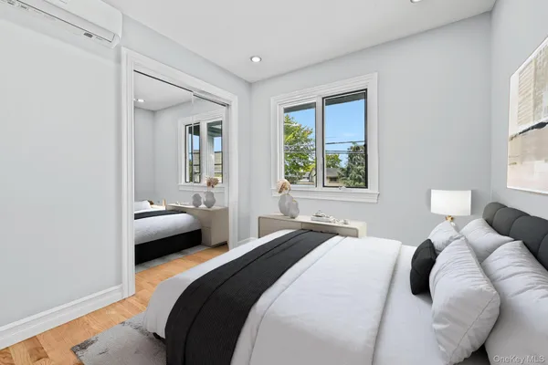 a bedroom with a bed and a dresser