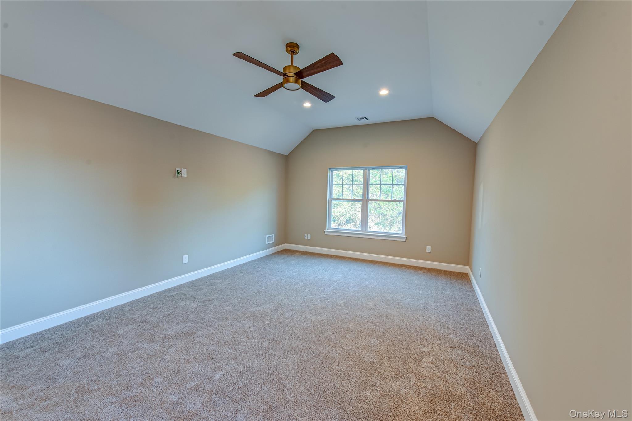 64 Blydenburgh Road Centereach, NY 11720 - Photo 31 of 44 Empty room with vaulted ceiling, light colored carpet, ceiling fan, and recessed lighting. For Marketing Purposes!