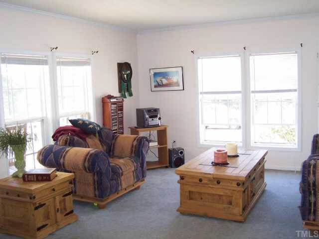 222 Robertson Road Roxboro, NC 27574 - Photo 6 of 10 a living room with furniture and a window