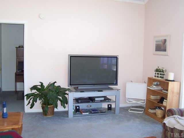 222 Robertson Road Roxboro, NC 27574 - Photo 7 of 10 a living room with furniture and a flat screen tv