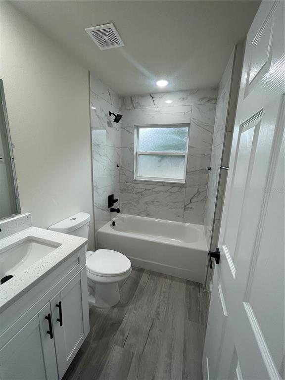 10631 North Frantz Avenue Citrus Springs, FL 34434 - Photo 17 of 21 a bathroom with a sink a toilet a mirror and shower