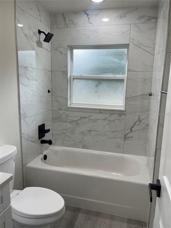 10631 North Frantz Avenue Citrus Springs, FL 34434 - Photo 18 of 21 a bathroom with a bathtub and a toilet