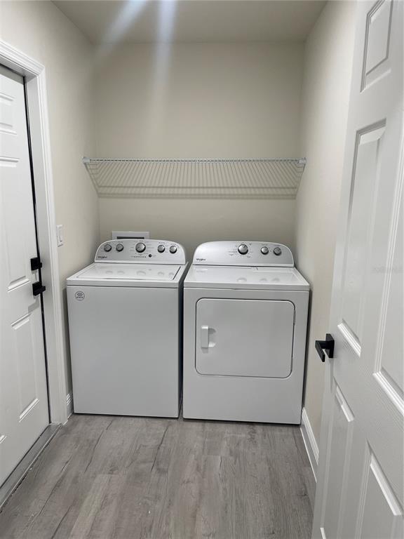 10631 North Frantz Avenue Citrus Springs, FL 34434 - Photo 19 of 21 a utility room with dryer and washer