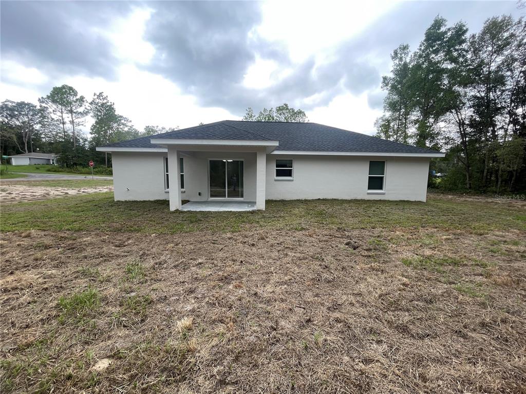10631 North Frantz Avenue Citrus Springs, FL 34434 - Photo 21 of 21 a house with a garden