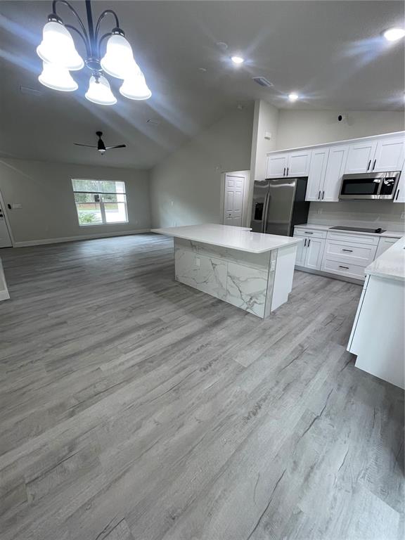 10631 North Frantz Avenue Citrus Springs, FL 34434 - Photo 6 of 21 a living room with furniture and a wooden floor