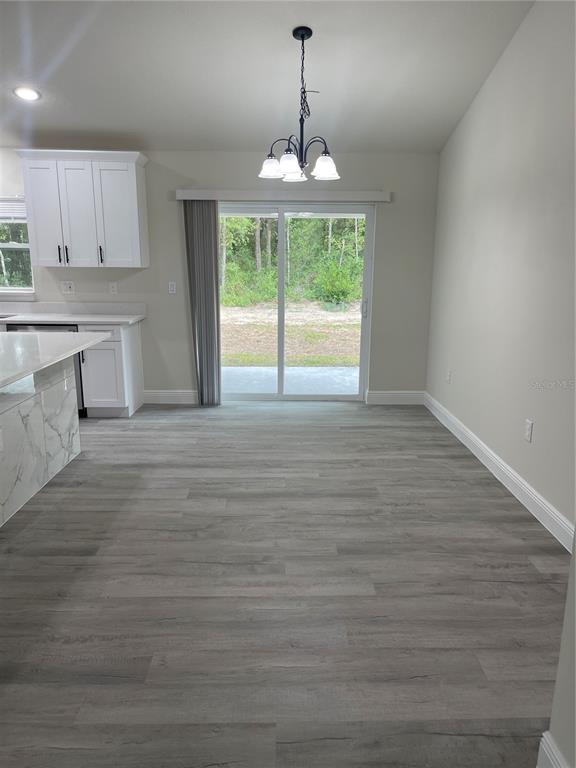 10631 North Frantz Avenue Citrus Springs, FL 34434 - Photo 7 of 21 a view of a kitchen with microwave and cabinets