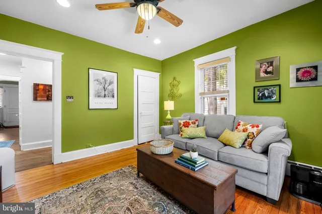 a living room with furniture and a rug
