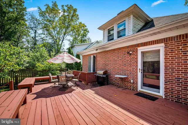 a view of a patio with table and chairs and potted plants