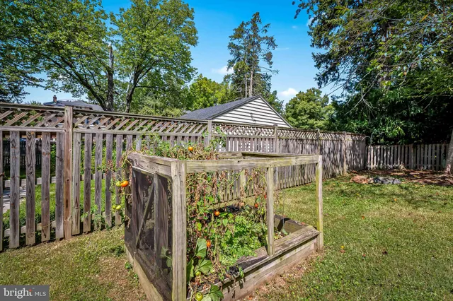 a view of a house with yard and sitting area