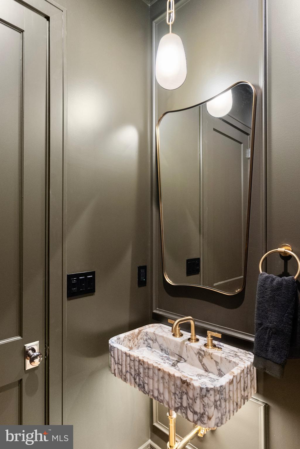 7923 Chelton Road Bethesda, MD 20814 - Photo 22 of 44 a bathroom with a sink and a mirror