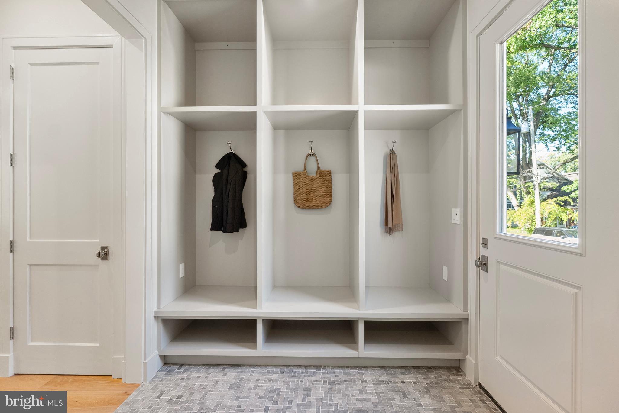 7923 Chelton Road Bethesda, MD 20814 - Photo 24 of 44 a bathroom with a glass shower door