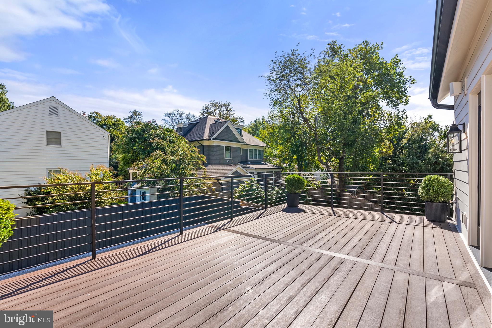 7923 Chelton Road Bethesda, MD 20814 - Photo 28 of 44 a view of deck with wooden floor and outdoor seating
