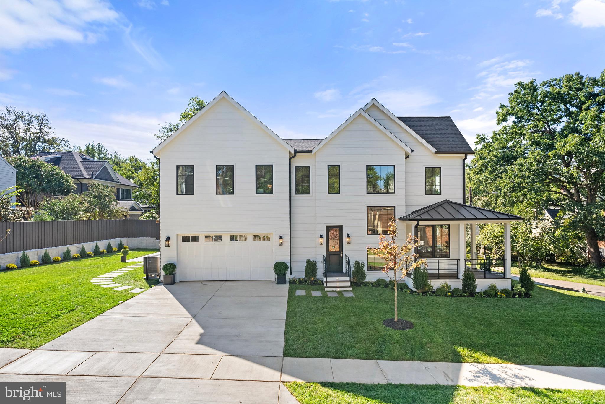 7923 Chelton Road Bethesda, MD 20814 - Photo 3 of 44 a front view of a house with a yard