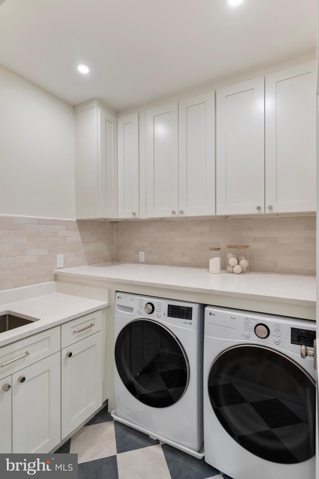 7923 Chelton Road Bethesda, MD 20814 - Photo 35 of 44 a view of a washer and dryer in a kitchen