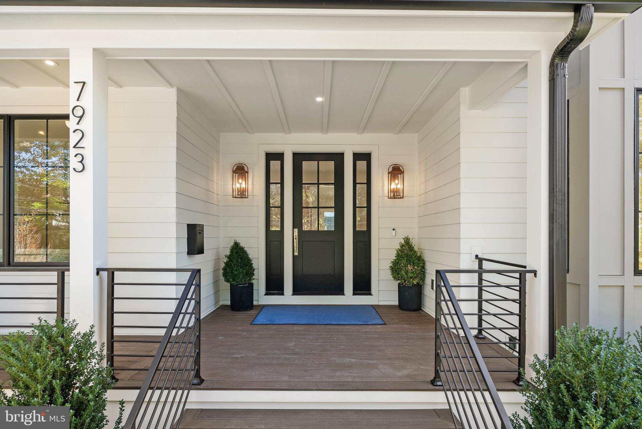 7923 Chelton Road Bethesda, MD 20814 - Photo 5 of 44 a front view of a house with a porch