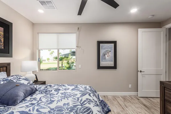 a bedroom with a bed and a window
