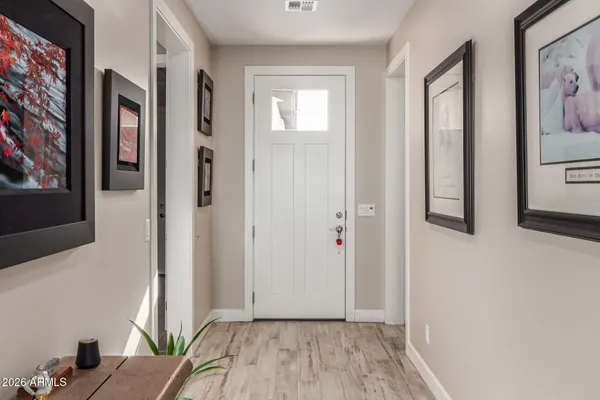 a view of livingroom with hardwood floor and hallway