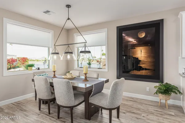 a dining room with furniture and window