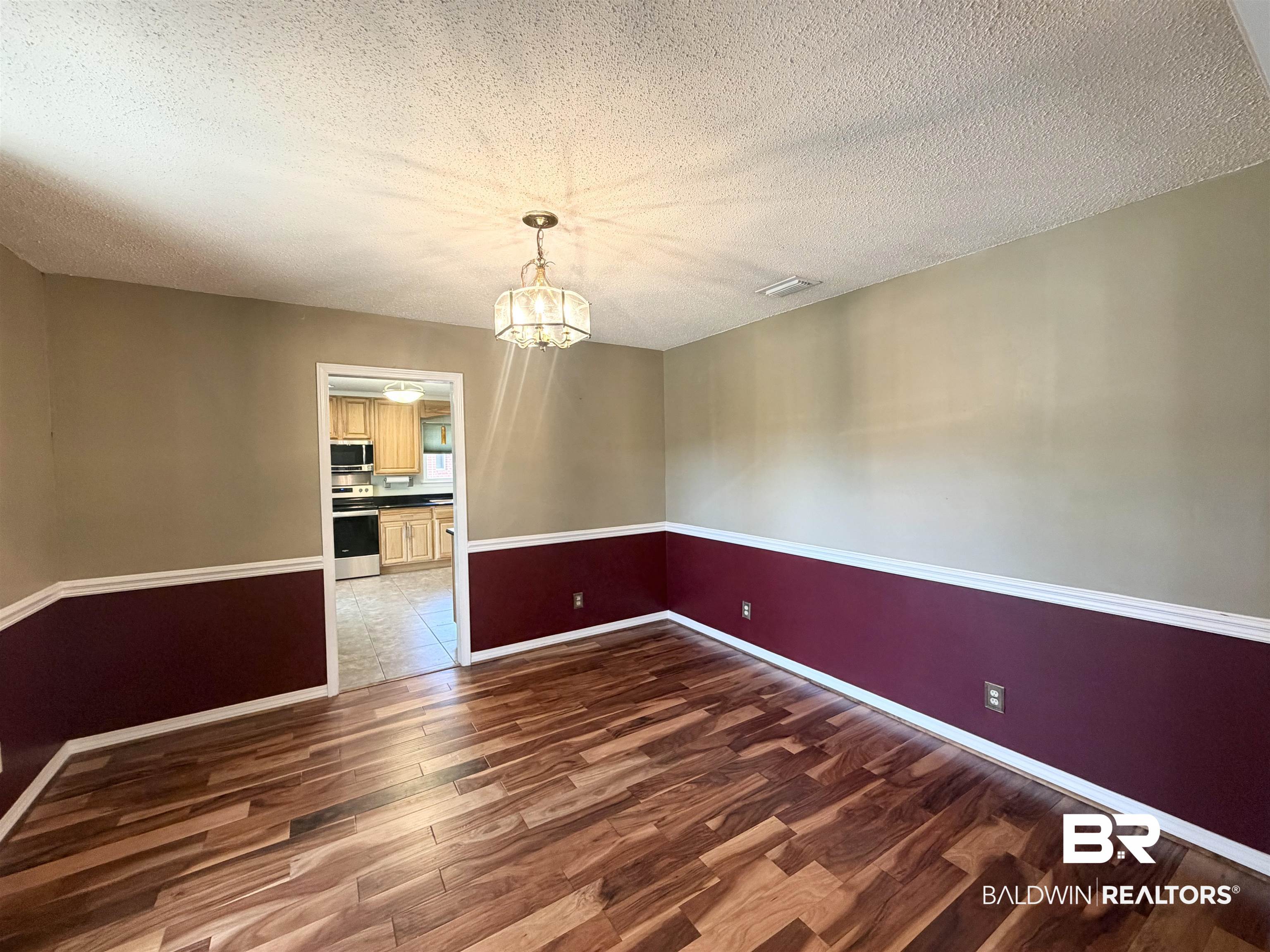 7310 Cheryl Court Mobile, AL 36695 - Photo 6 of 23 Dining room featuring dark wood-style floors