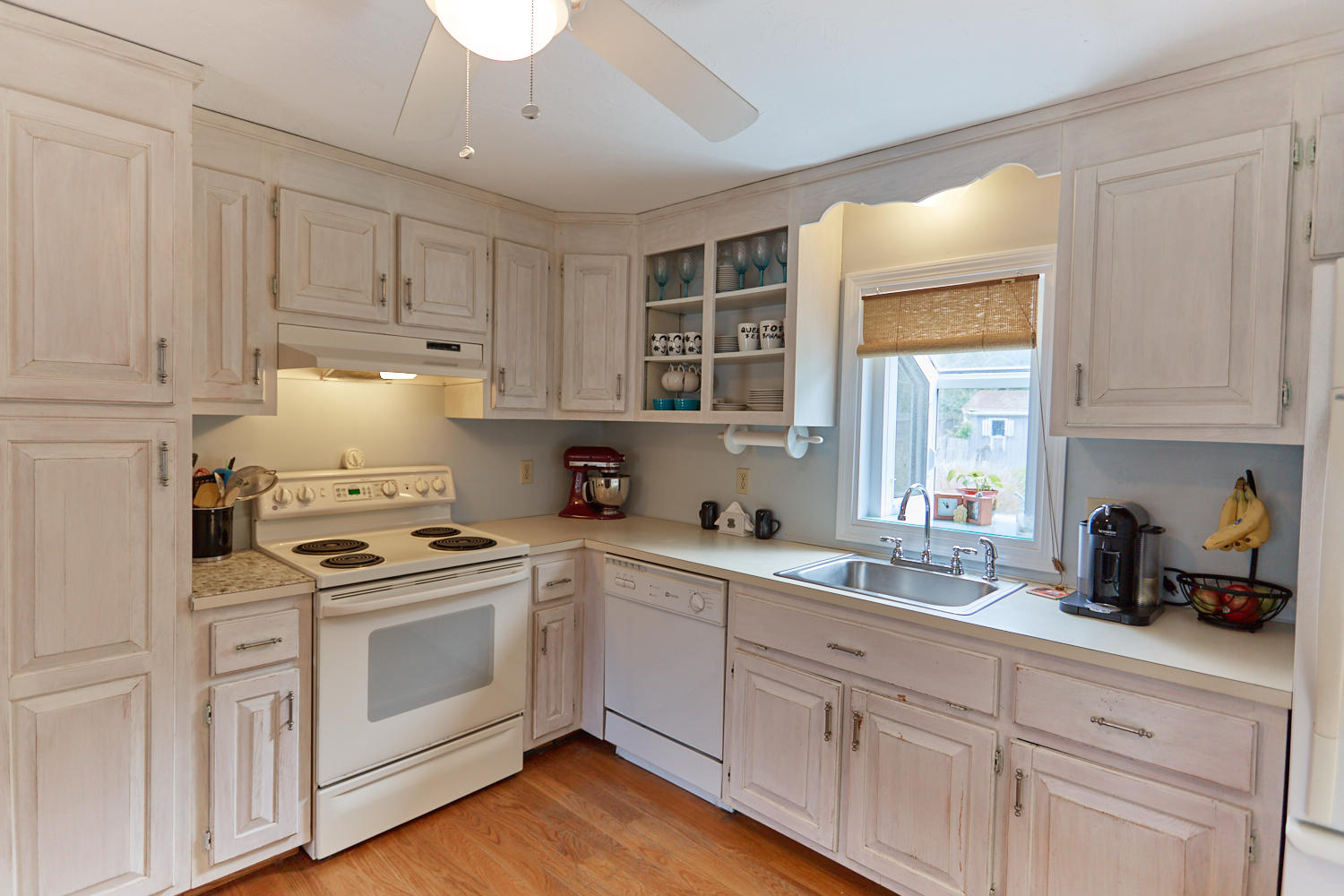 106 Foxglove Road Centerville, MA 02632 - Photo 6 of 23 a kitchen with white cabinets and white appliances