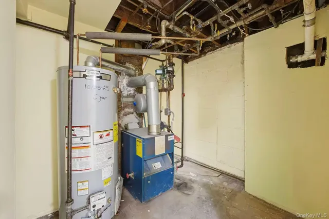 a view of a storage & utility room with windows